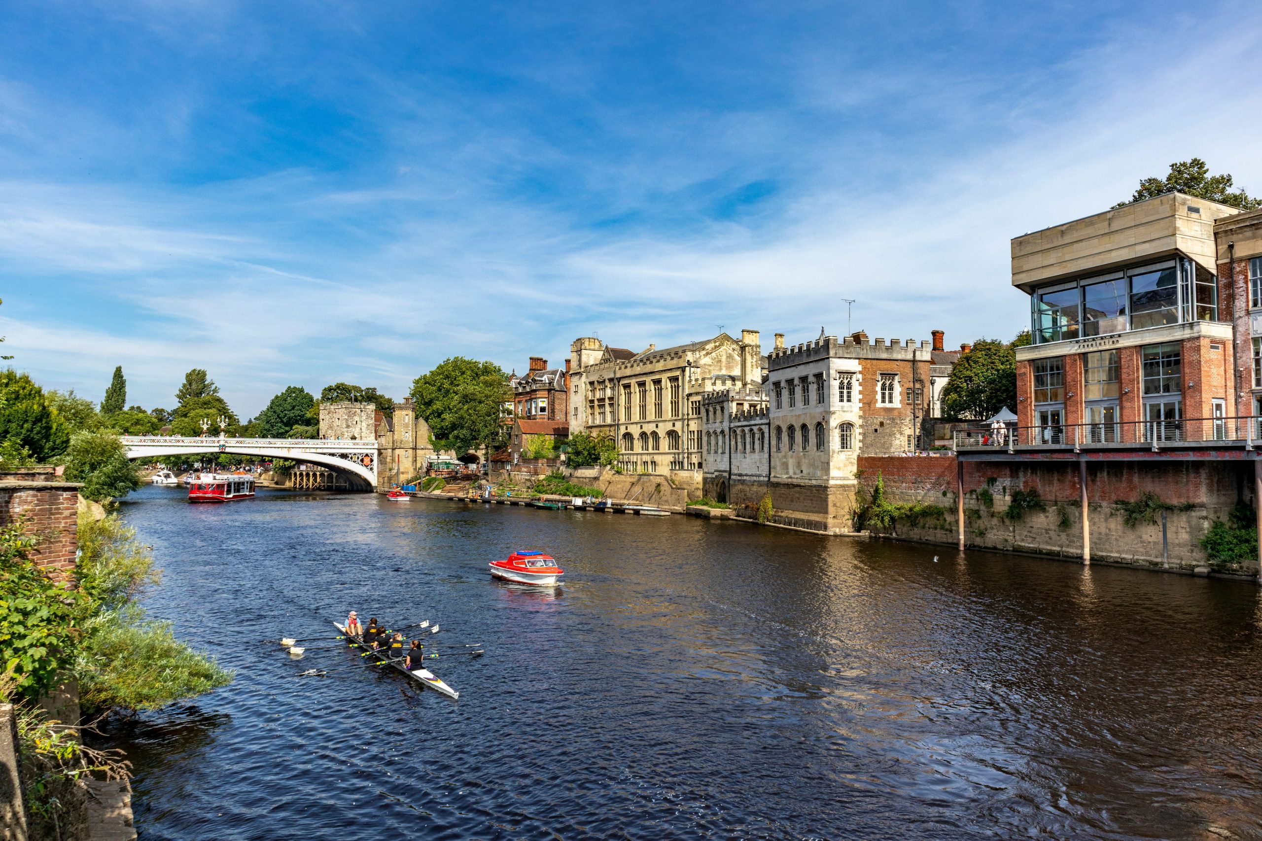 https://unsplash.com/photos/people-riding-on-boat-on-river-near-buildings-during-daytime-CeP88BpAdvE